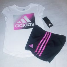 Brand New Never Worn With Tags. Adidas Set Includes A White With Black And Pink Trim Short Shoulder Sleeve Cotton Blend Tee With "Adidas" Inscription. Bottoms Are Black With Pink Trim Polyester Breathable Mesh Blend Design With Elastic Waistline And 3 Logo And Inscription On Left Leg With 3 Pink Stripes Down Each Outer Leg. Set Fits 5 Toddler Girls Or 6 Youth Girls. Any Questions, Please Contact Me. Thanks! Adidas Set, Black Tracksuit, Soccer Outfit, Adidas Retro, Adidas Short, 3 Logo, Adidas Joggers, Adidas Girl, Adidas Outfit