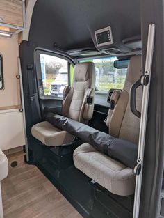 the interior of an rv with two seats