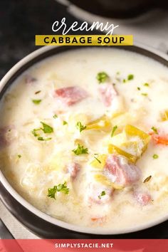 a bowl of creamy cabbage soup with carrots and parsley