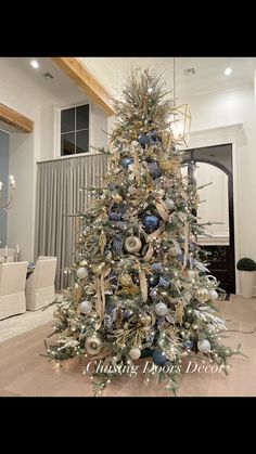 a christmas tree with blue and gold ornaments