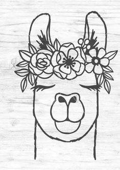 an animal with flowers on its head is drawn in black and white, against a wooden background