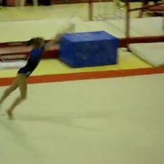 a woman is skating on an indoor ice rink