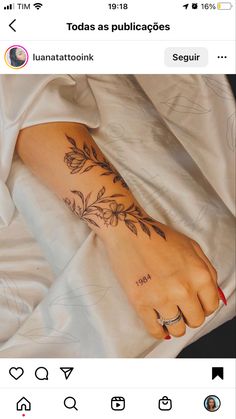 a person's foot with tattoos on it