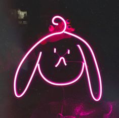 a neon sign with a dog's head in the shape of a human face