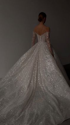 the back of a wedding dress with sequins on it