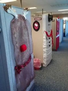 an office cubicle decorated for christmas with decorations