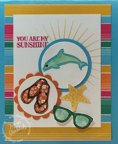 a card with an image of flip flops, sunglasses and a dolphin