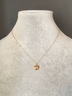 "A sweet and simple 24k solid matte gold vermeil heart charm dangles from a 14k gold filled chain. The chain is adjustable and can be worn close to the neck at 16\" or a little longer at 18\". It is finished with a spring ring clasp. Please send a message if a longer chain is desired. Wear this necklace by itself or as a layering piece. A perfect gift for Valentine's Day, birthday, anniversary or bridal party. Multiple quantities can be special ordered. Heart charm: 9x9mm Total length of pendant Chain With Heart Pendant, Gold Simple Necklaces, Simple Gold Heart Necklace, Gold Chain With Heart Pendant, Small Gold Heart Necklace, Simple Neck Chain Designs Gold, Small Pendant Necklace Gold, Gold Heart Pendant Necklace, Small Chains Gold With Pendant