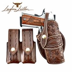 a brown leather holster with two matching belts