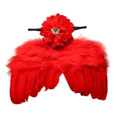 a red feathered headband with a flower on the top and two feathers attached to it