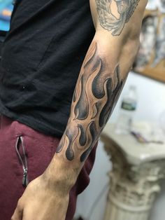 a man with a tattoo on his arm