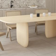 a table and chairs in a room with white tile flooring on the wall behind it