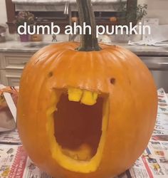 a pumpkin with its mouth open on top of a table