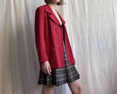 Vintage double breasted blazer in red. Fully lined, notch lapel collar, big flap pockets, metal buttons. ✏️ TAGS SAND WOMEN 53% polyester 43% wool 4% elastane Made in EU 📏 SIZE Tag on item 40 Modern size Medium or smaller bust Large ✂️ CONDITION  Good vintage condition, cleaned and ready to wear. 📏 MEASUREMENTS Measured laying flat, please double for circumference:  length 27 1/2"   70cm shoulders 17" 43cm bust 20" 51cm waist 16 1/2" 42.5cm sleeve 21 1/2" 54.5cm 📌 PLEASE NOTE  If you're in do Red Double-breasted Long Sleeve Blazer, Red Double-breasted Pea Coat With Buttons, Red Long Sleeve Double-breasted Blazer, Red Double-breasted Outerwear For Office, Classic Red Double-breasted Blazer, Red Double-breasted Business Blazer, Red Double-breasted Office Blazer, Red Double-breasted Blazer For Business, Red Double-breasted Blazer For Office