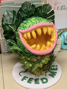 a planter with a fake monster's mouth and teeth on top of it