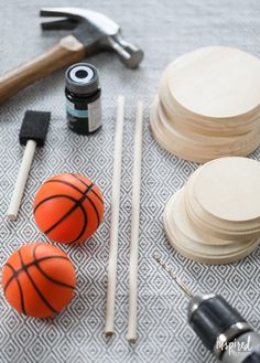 the tools are laying out on the table to be used for making basketballs and other sports related items