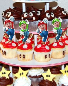 there are cupcakes with pictures of mario on them