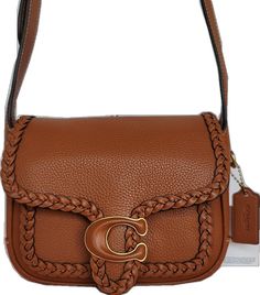 Coach Rectangular Textured Leather Satchel, Coach Textured Leather Rectangular Satchel, Formal Textured Leather Rectangular Saddle Bag, Rectangular Textured Leather Saddle Bag, Textured Leather Rectangular Saddle Bag, Luxury Rectangular Textured Leather Saddle Bag, Coach Rectangular Saddle Bag For Daily Use, Rectangular Coach Saddle Bag For Daily Use, Coach Brown Leather Saddle Bag