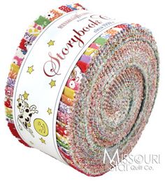 a roll of multicolored fabric with the words hello baby on it's side