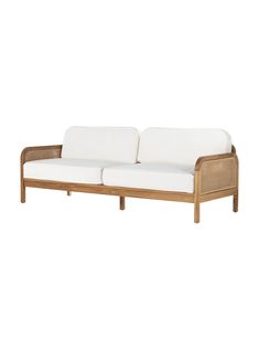 an outdoor sofa with white cushions and wood frame, on a white background in front of a