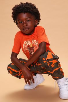 Available In Orange/combo. Cargo Jogger Pant Allover Camo Print Cargo Pockets 6 Pocket Elastic Cuff Disclaimer: Print Placement May Vary 82% Cotton 18% Rayon Imported | Mini Camo Game Strong Cargo Jogger Pant in Orange size 4 by Fashion Nova Cotton Bottoms With Graphic Print For Playwear, Cotton Graphic Print Bottoms For Playwear, Casual Graphic Print Bottoms For Playwear, Orange Cotton Bottoms For Playwear, Orange Outfit, Cargo Joggers, Print Placement, Kids Pants, Casual Black