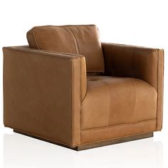 a brown leather chair sitting on top of a white floor