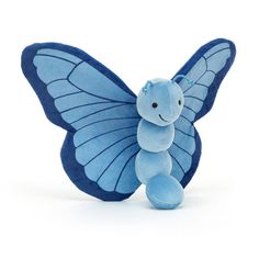 a blue butterfly stuffed animal on a white background