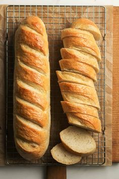 two loaves of bread on a cooling rack