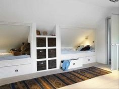 a bedroom with bunk beds and white walls