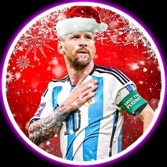 a soccer player wearing a santa hat and holding his hands together in front of the camera