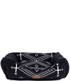 a black dog bed with white crosses on the front and back, sitting against a white background