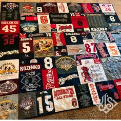 a quilt made out of sports jerseys on the floor