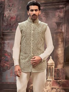 Traditionally crafted Beige color nehru jacket for your special occasions to make heads turn at you.This nehru jacket is crafted from Silk ifabric which is one of the softest and most luxurious fabric and addorned with the beautifully designed kashida thread emroidery all over, Nehru jacket,nehru jacket for mens,nehru jacket wedding,nehru jacket suit,designer nehru jacket,wedding nehru jacket COST INCLUDES NEHRU JACKET Luxury Nehru Jacket With Naqshi For Reception, Gold Nehru Jacket For Groom, Festive Occasion, Elegant Green Nehru Jacket For Festive Occasions, Elegant Green Outerwear For Eid, Traditional Fitted Nehru Jacket For Ceremony, Fitted Nehru Jacket For Festive Ceremonies, Stand Collar Kurta For Wedding And Festivals, Festive Fitted Nehru Jacket For Ceremony, Wedding Kurta With Stand Collar For Festivals