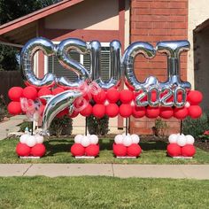 balloons and streamers are arranged in the shape of letters that spell out'2013