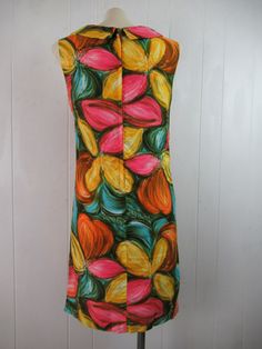 "Vintage 1960s multi color cotton dress. Has painterly floral design, scoop neck with collar, orange Acrylic lining and back zipper. Made by Charlotta of California. About a size medium. Actual measurements are: 37\" around the bust 35\" around the waist 35.5\" around the hips 14.5\" shoulder to shoulder 31\" overall length In very good condition." Mod Style Multicolor Floral Print Dress, Multicolor Mod Dress With Floral Print, Mod Multicolor Floral Print Dress, Multicolor Mod Floral Print Dress, Painterly Floral, Vintage Dresses 1960s, 1960s Dress, Beauty Forever, 1970s Dresses