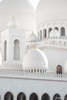 a white building with many arches and domes