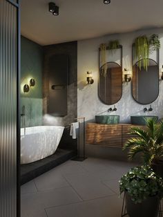 a bathroom with two sinks and three mirrors on the wall next to a bathtub