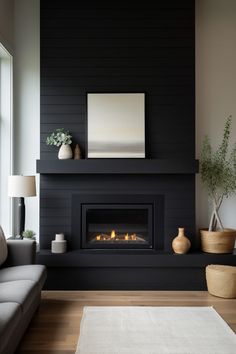 a living room with a couch and fireplace