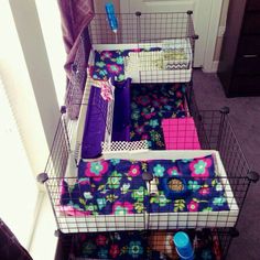 three cages with various items in them sitting on the floor