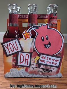 a bottle holder made out of soda bottles and paper cutouts with the words you do on them