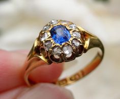 Free shipping!  This is an extremely beautiful Victorian blue sapphire and old cut diamond cluster ring. The vibrant royal blue sapphire of .33 carat is surrounded by a sparkly halo of SI, H/I  old rose cut diamonds. The diamonds total .2 carat. Like most antique rings, the gold has a real glow to it. The ring is perfectly proportioned, with graceful shoulders and is in excellent condition for its age.  Fully hallmarked.  Current retail value for age, diamond quality and content is au$3,450 as p Heirloom Blue Sapphire Ring With Rose Cut Diamonds, Antique Blue Rings With Brilliant Cut, Antique Blue Brilliant Cut Ring, Sapphire Diamond Ring With 17 Jewels For Wedding, Blue Diamond Ring With Single Cut Diamonds For Wedding, Heirloom Blue Sapphire Cluster Ring, Antique Blue Diamond Ring Hallmarked, Antique Blue Diamond Ring With Rose Cut, Antique Blue Diamond Ring With Center Stone