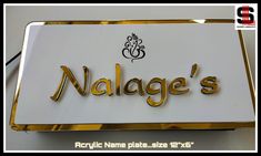 a close up of a sign that says nalage's on it with gold lettering