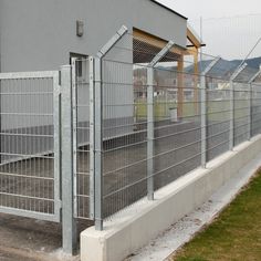 a fence that is next to a building