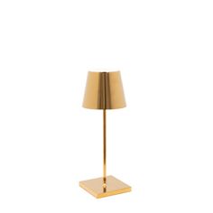 a gold lamp on a white background