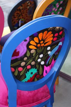 several colorful chairs sitting next to each other