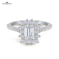 an emerald cut diamond ring with diamonds around it