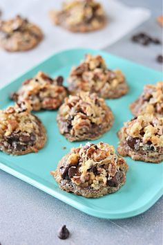 chocolate chip cookies are on a blue plate