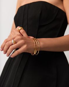 Trio Molten Ripple Bangle Bracelet Set | 18k Gold Vermeil. More is More. Make a Statement with this Standout Bracelet Set, Featuring Three of Our Molten Ripple Bangles. This Delicate Bangle Bracelet Features an Organic-Inspired Shape with Our Signature Molten Wavy Detailing. Stack All Three Together, Balance Out Across Both Wrists, or Wear Solo for Endless Ways to Style. Worth $693, Save $84 When Buying Together. Metal: 18K Recycled Gold Vermeil on Recycled Sterling Silver Small Band Width Varie Elegant Open Band Cuff Bracelet, Chic Formal Jewelry With Open Band, Chic Open Band Jewelry For Gifts, Chic Formal Open Band Jewelry, Modern Double Band Bracelet With Strap, Elegant Gold Open Band Bangle, Luxury Stackable Open Band Jewelry, Timeless Gold Plated Bracelet For Everyday Luxury, Polished Yellow Gold Double Band Jewelry