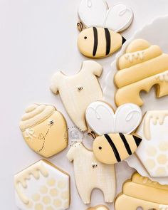 decorated cookies in the shape of bees and honeycombs