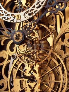 a close up view of an old clock face with gears attached to the dials